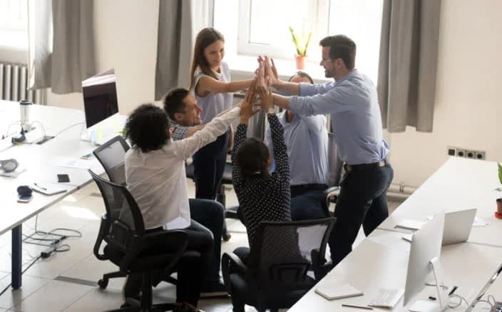 Corporate team high-fiving